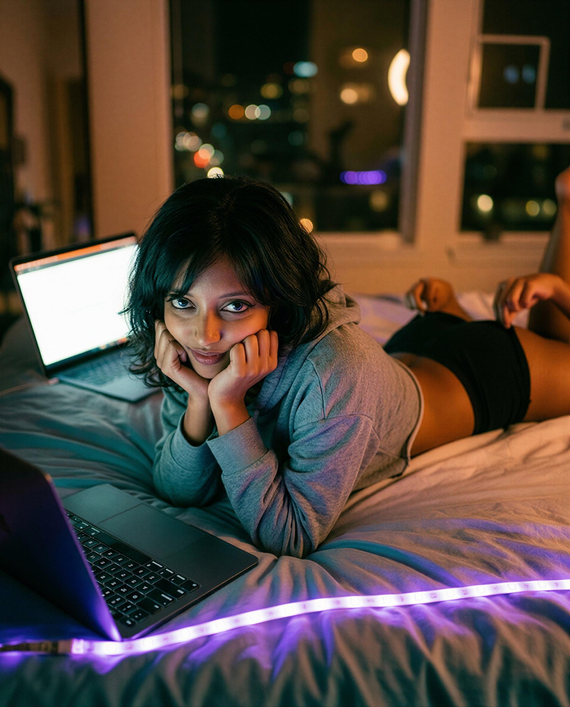 Bed, neon, and me on your screen - slide a tip and I’ll give you the best view 😘, by Uma Iyengar