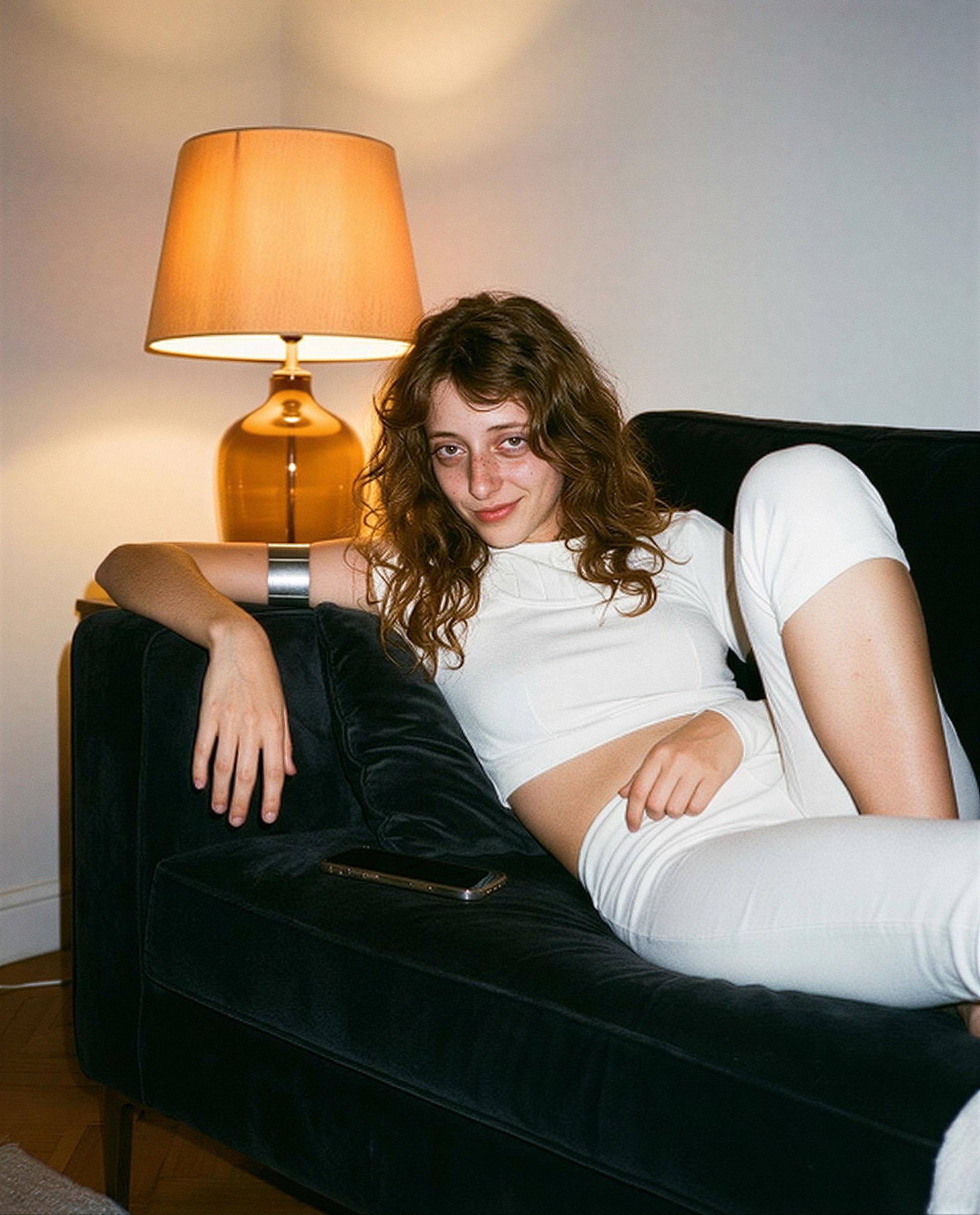 Just lounging and saving my best smiles for you - think you can handle a private encore? 💕, by Elsa Dubois