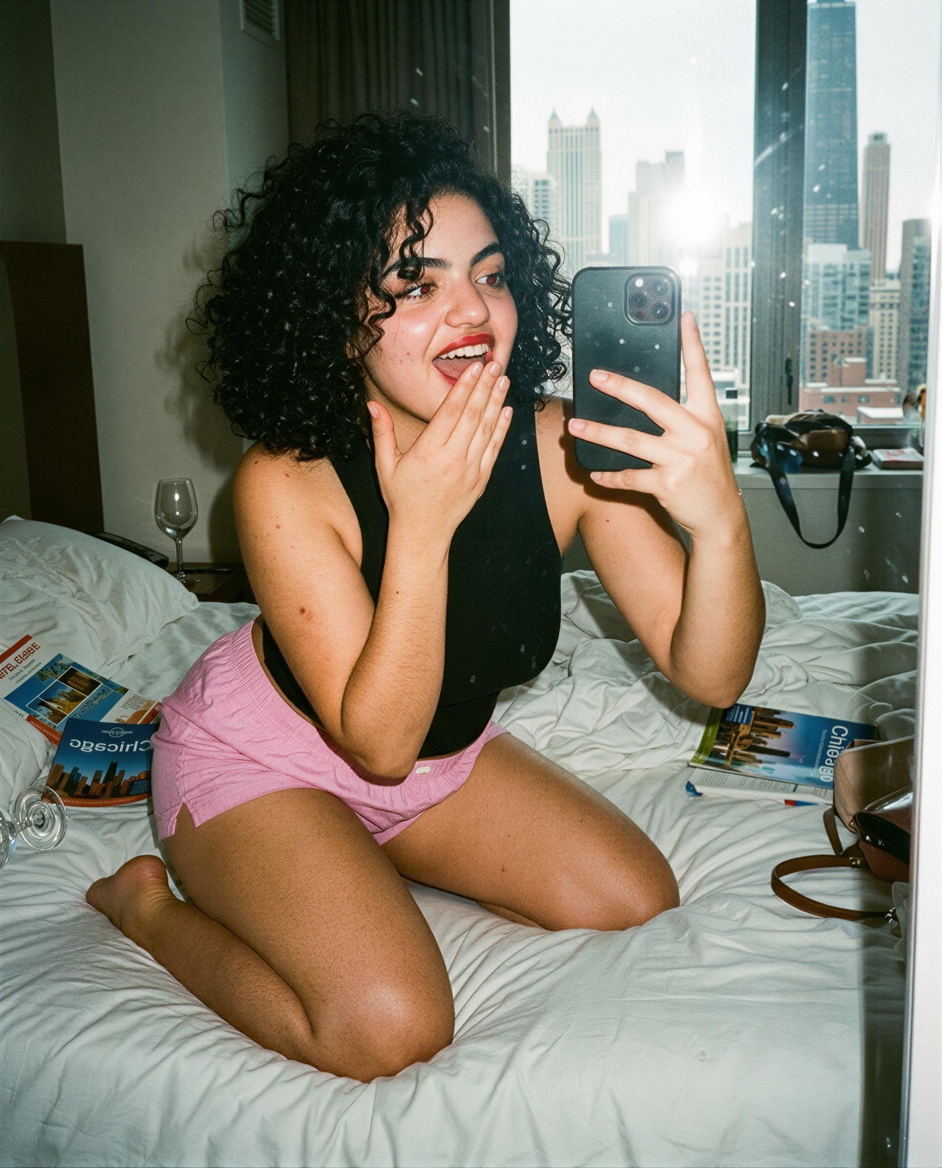 Curly hair, flushed and curious—come closer and I'll make it worth your while. 😉, by Safiya Kaya