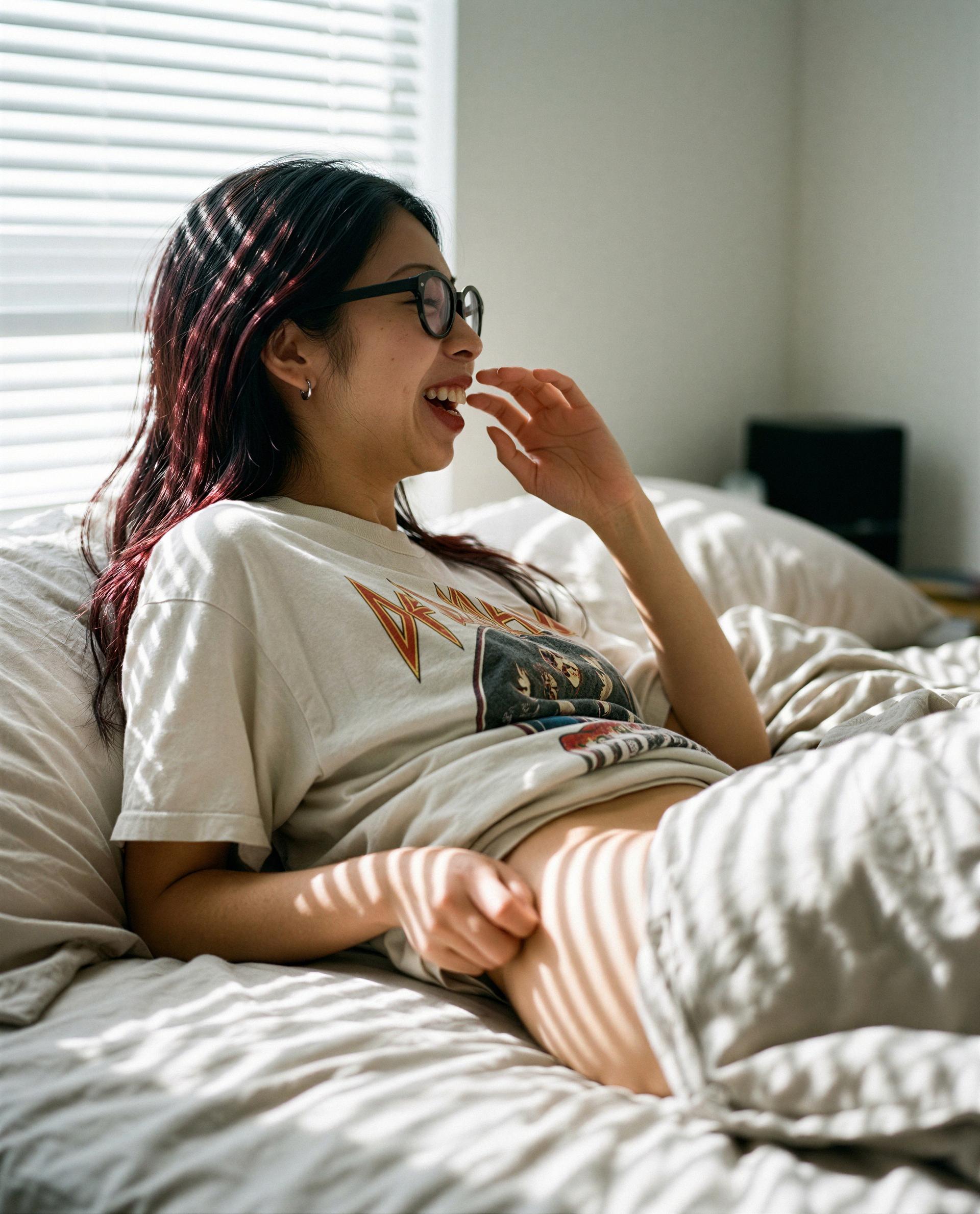 Caught laughing in my tee—slide under the covers and be my favorite secret? 💕, by Sanya Sharma