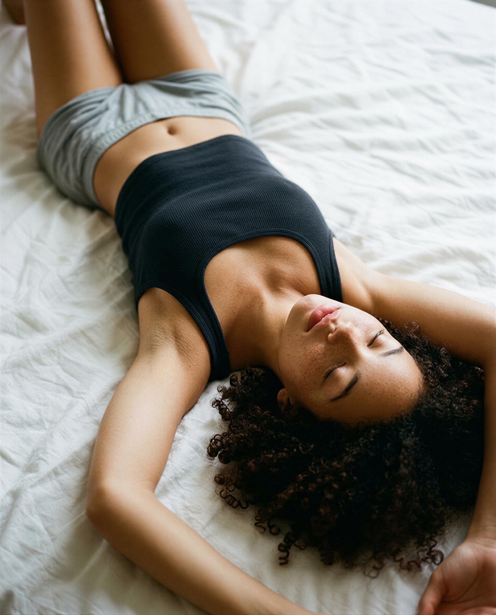 Curled up and daydreaming about you—should we make it a private show? 🫣💋, by Grace Johnson