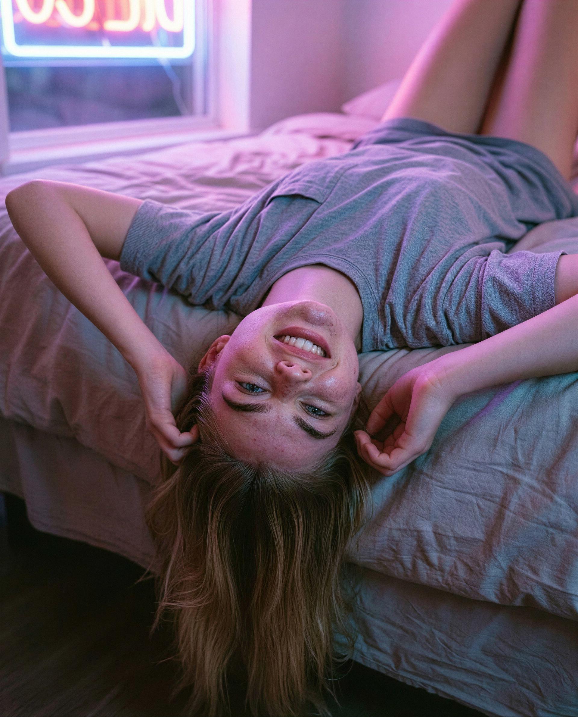 Upside down, grinning, and plotting ways to keep you here all night - tempted? 😉💕, by Nora Rossi
