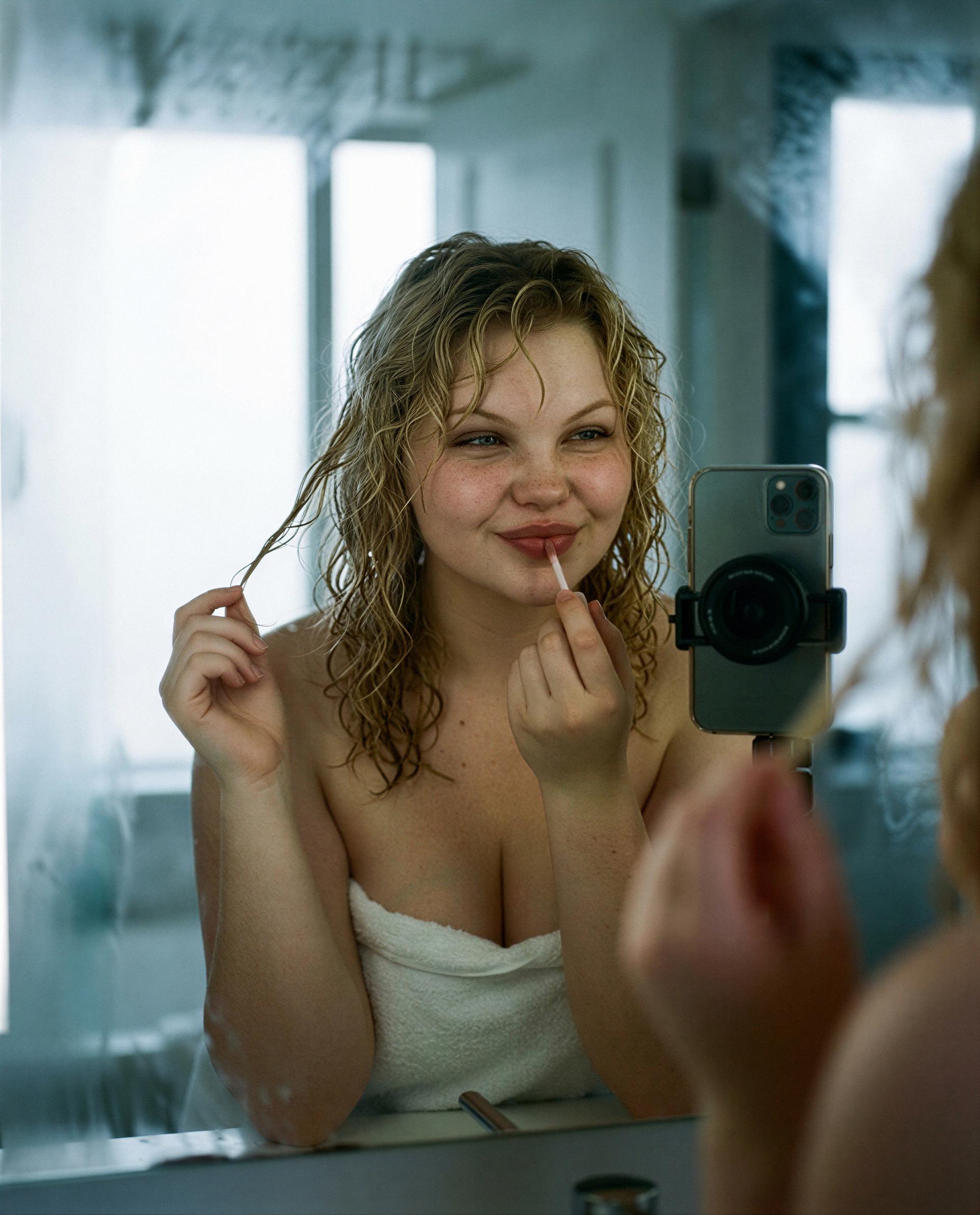 Applying gloss for someone special—could that someone be you? 🥺💋, by Anna Petrova