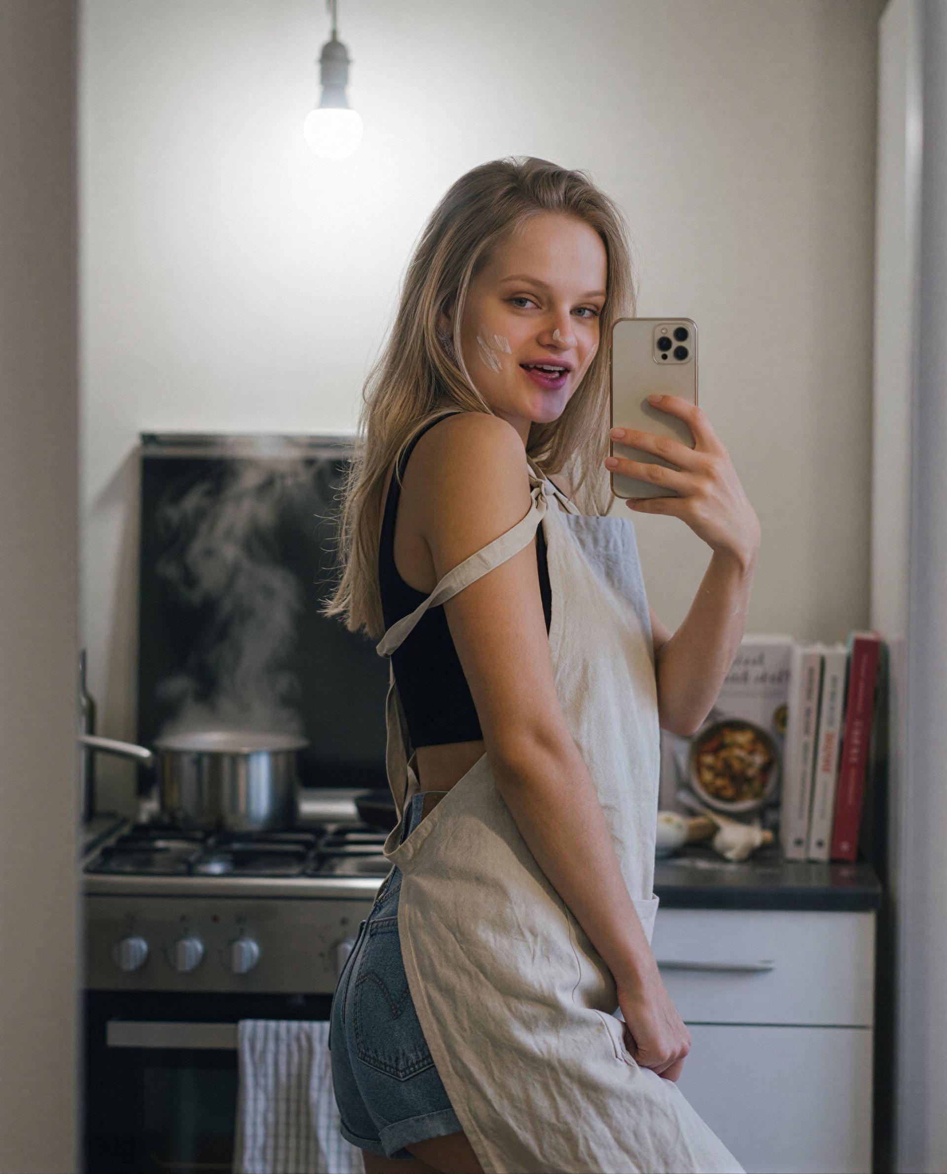 apron on, cheeks messy - tip me and I’ll whisper the secret off-camera, just for you 😳, by Elodie Moreau