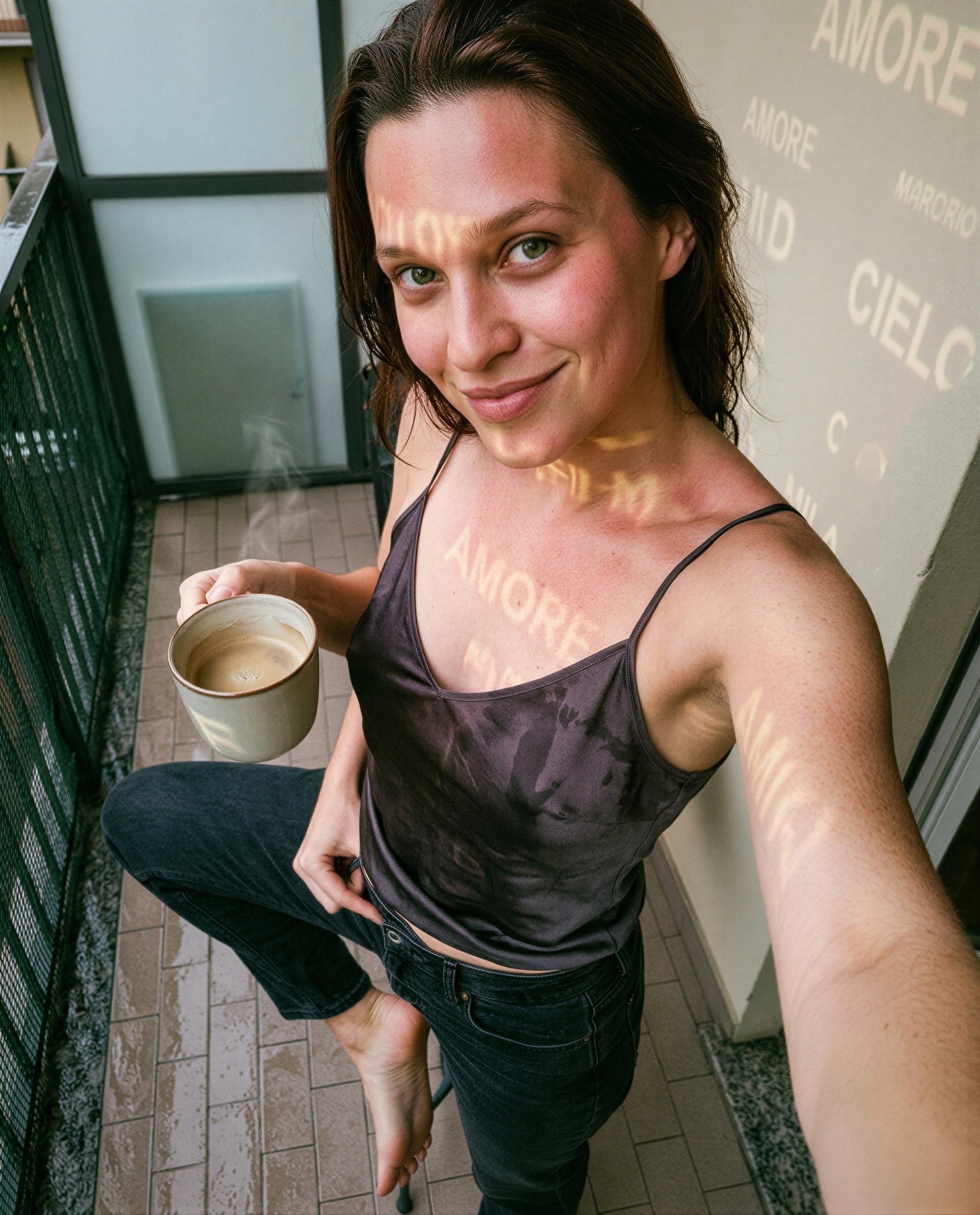 Amore on my skin and your name on my mind—wanna steal this balcony with me? 😉, by Anna Ricci