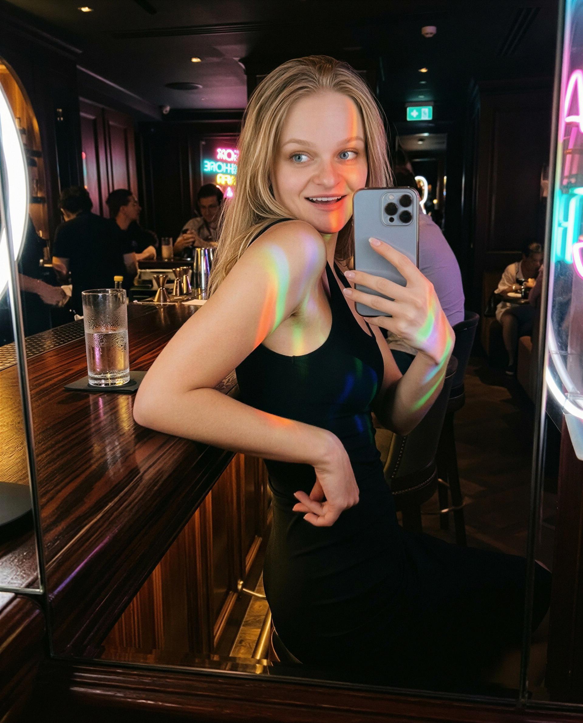 Bar mirror, neon streaks, and a locked little show - unlock it and I’ll blush for you 😳, by Elodie Moreau