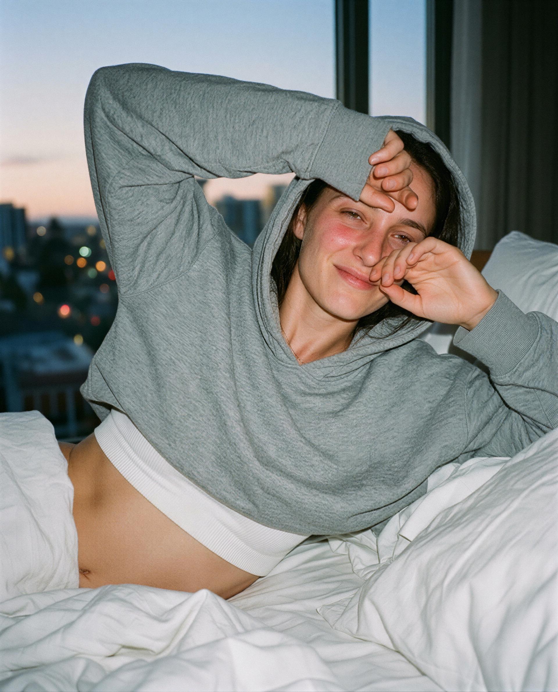 Hoodie on, skin warm—come wake me up the right way, babe 😘, by Emily Schäfer
