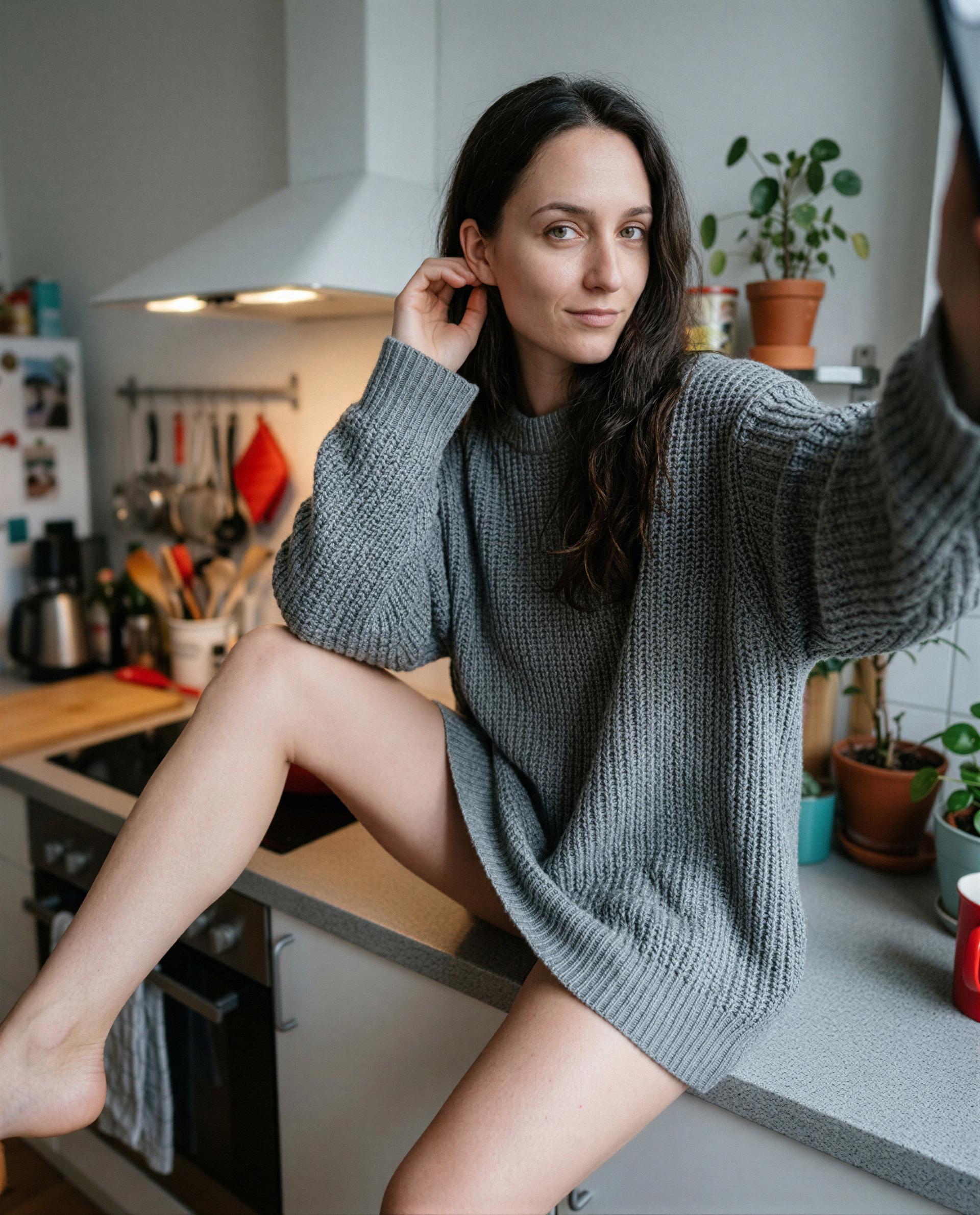 Perched on the counter in my favorite knit - come closer and I’ll give you a private tour 😘, by Emily Schäfer