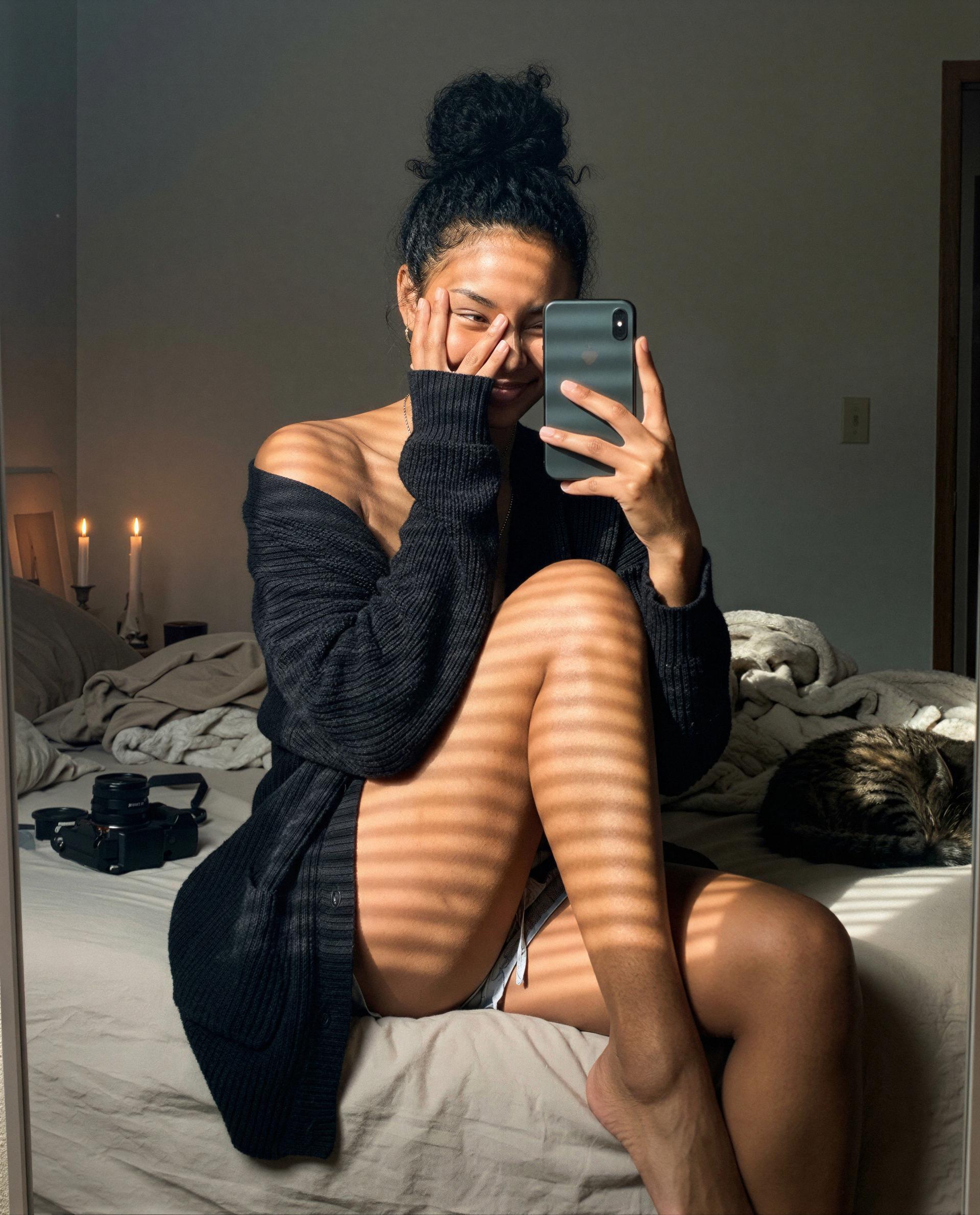sneaking something special behind this cardigan—poke my DMs if you dare 🫣, by Ayanna Quaye