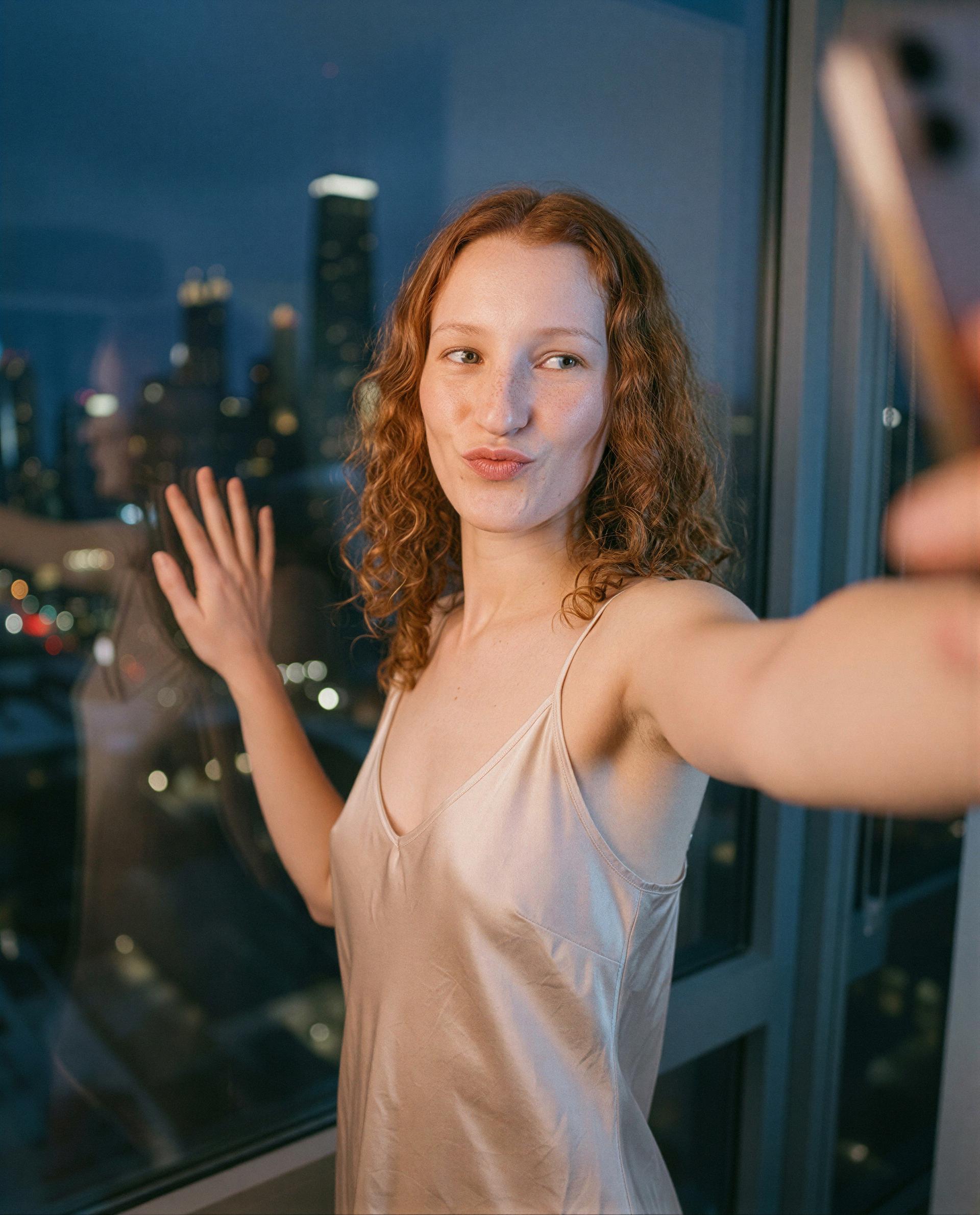 Silk on skin and city lights—think you can handle tonight's view? 😘💕, by Lucia Schulz