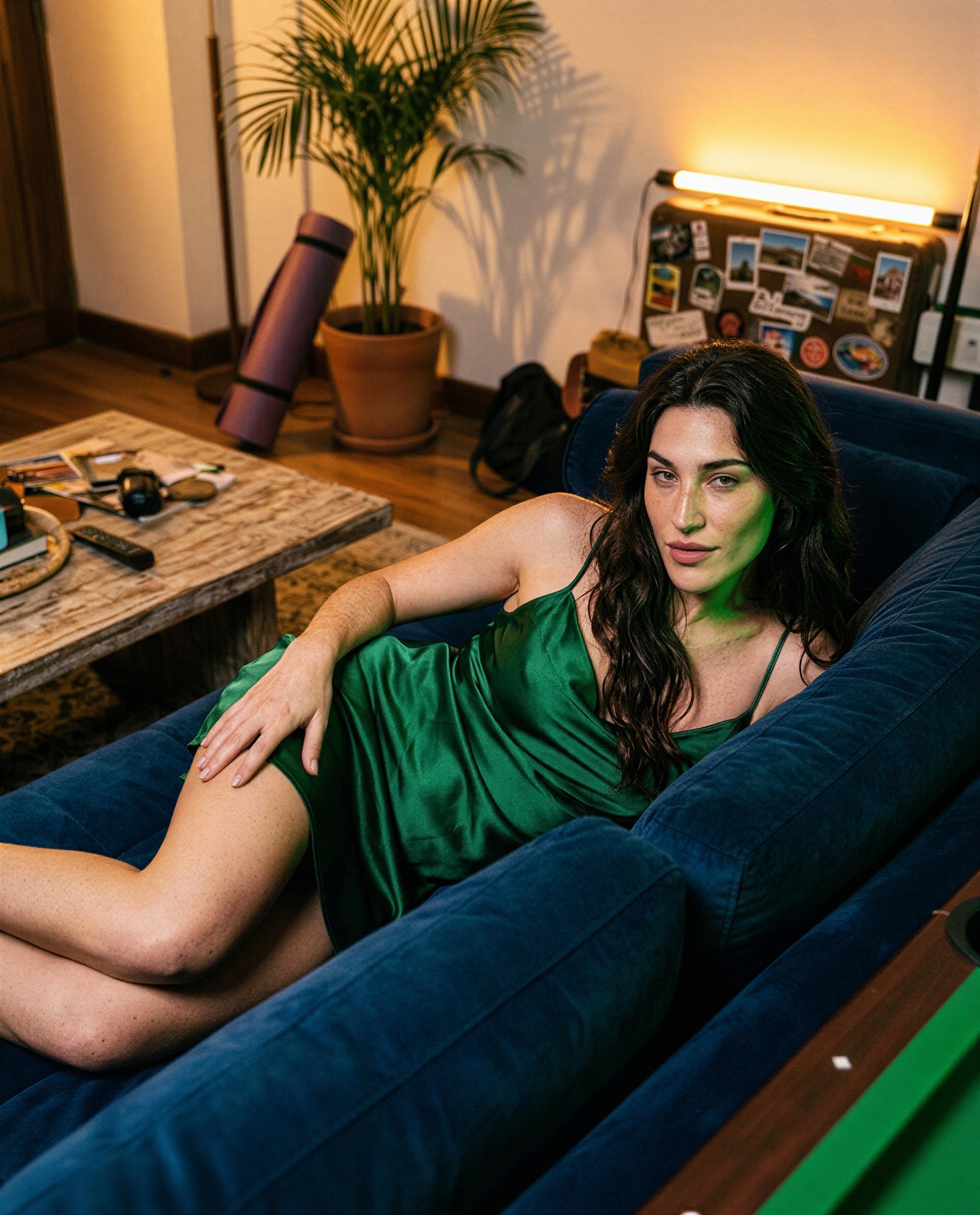 Emerald dress, slow smile—unlock my private feed and I'll make this couch feel like heaven for two 😉, by Paz García