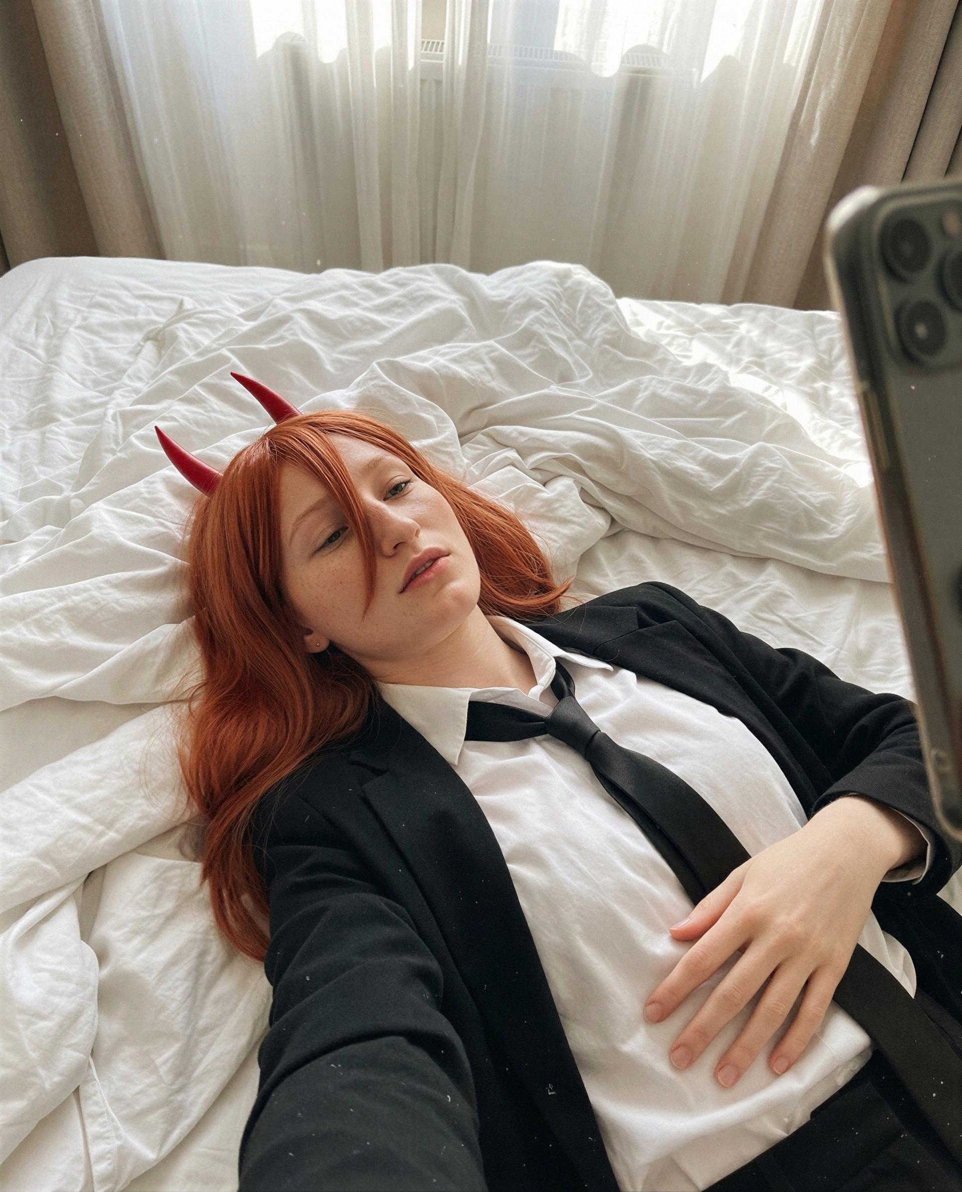 Lying here in a borrowed suit, untied and unapologetic - which rule will you break with me? 😉💕, by Lucia Schulz