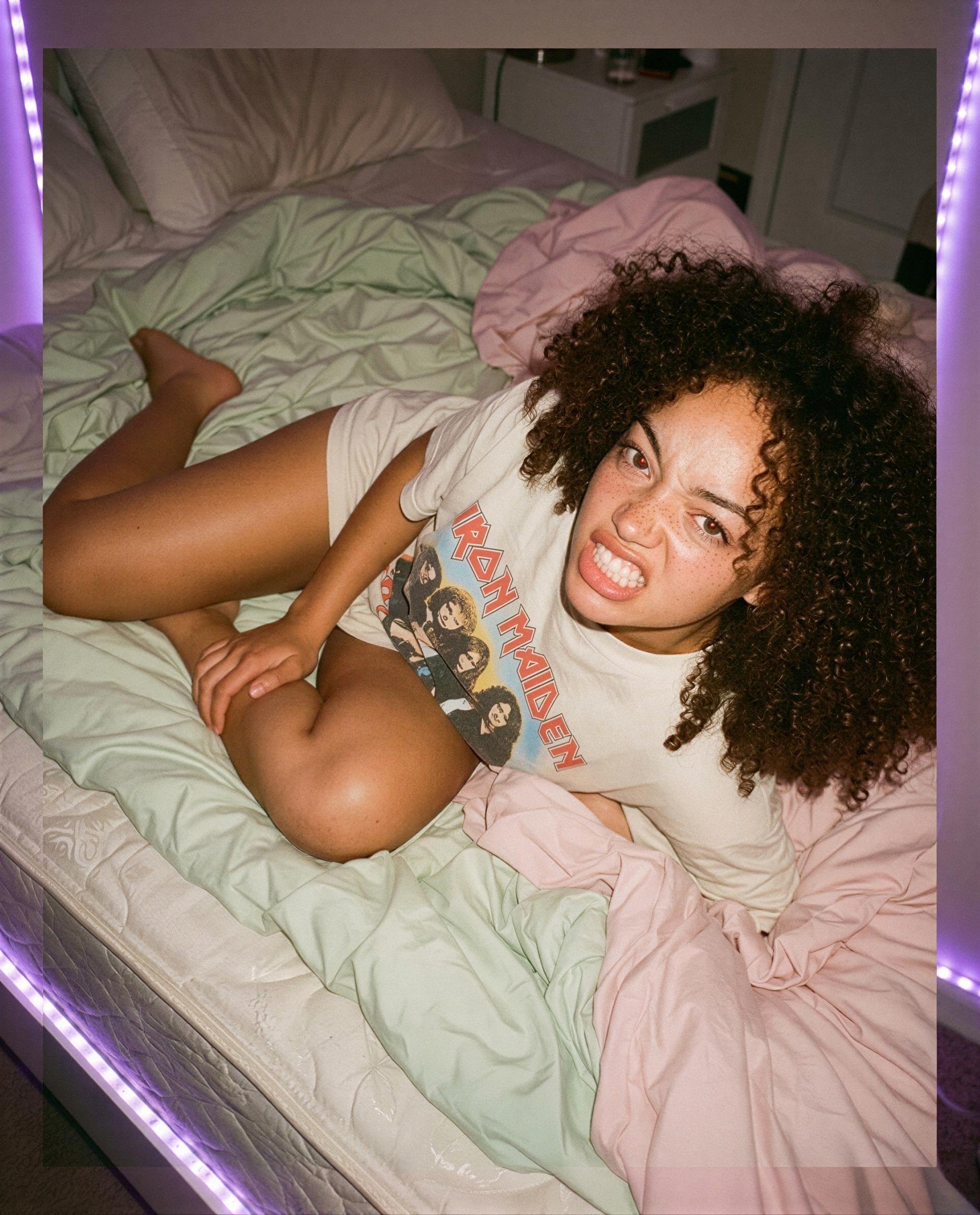 rock tee, messy bed, and a little trouble - wanna be the one who gets the encore? 😳🎸, by Grace Johnson